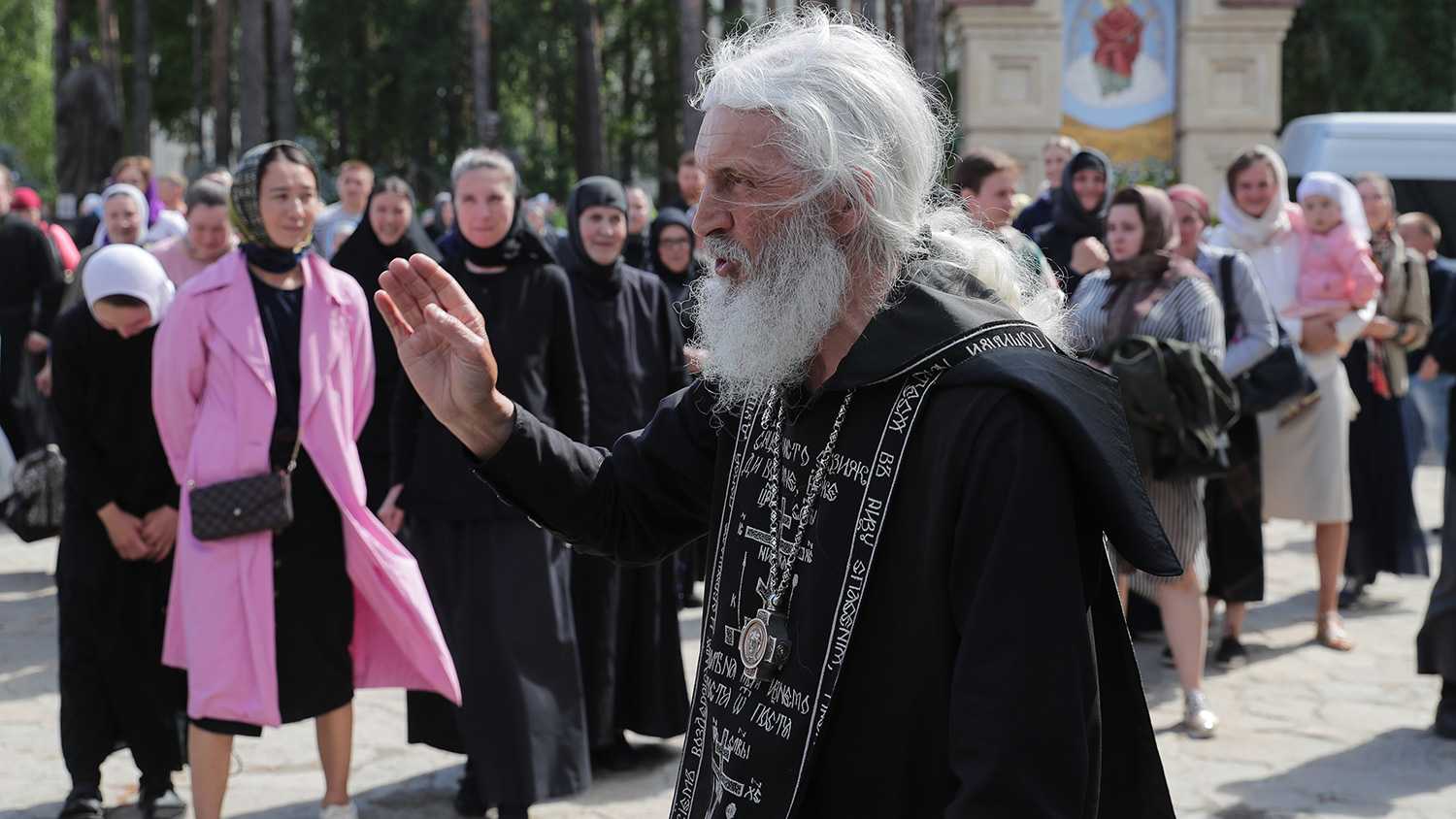 SREDNEURALSK, SVERDLOVSK REGION, RUSSIA - JUNE 17, 2020: Schema-hegumen Sergius (Nikolai Romanov) walks at the Sredneuralsky Convent. On April 27, Sergius was suspended from preaching after a video of him urging believers not to obey the state and religious authorities and calling the COVID-19 coronavirus infection a pseudo pandemic started to circulate. In late May after violating the order the priest was banned from religious services and stripped of the right to wear a pectoral cross. On June 16, Mother Superior Varvara and nuns left the Sredneuralsky Convent in disagreement with Sergius' position on the COVID-19 coronavirus. Donat Sorokin/TASS

–осси€. —вердловска€ область. —реднеуральск. —хиигумен —ергий (Ќиколай –оманов) на территории —реднеуральского женского монастыр€. 16 июн€ насто€тельница монастыр€ монахин€ ¬арвара покинула обитель вместе сестрами в знак несогласи€ с позицией по коронавирусу схиигумена —ерги€ (Ќикола€ –оманова). 27 апрел€ схиигумена —ерги€ отстранили от проповедей после по€влени€ видеозаписи с его обращением, где он призывает прихожан не подчин€тьс€ власт€м и церковному руководству, называ€ коронавирусную инфекцию Ђпсевдопандемиейї. ¬ конце ма€ после нарушени€ запрета св€щенник был запрещен в служении, совершении таинств, лишен права ношени€ наперсного креста. ≈пархиальный суд ≈катеринбургской епархии открыл делоп