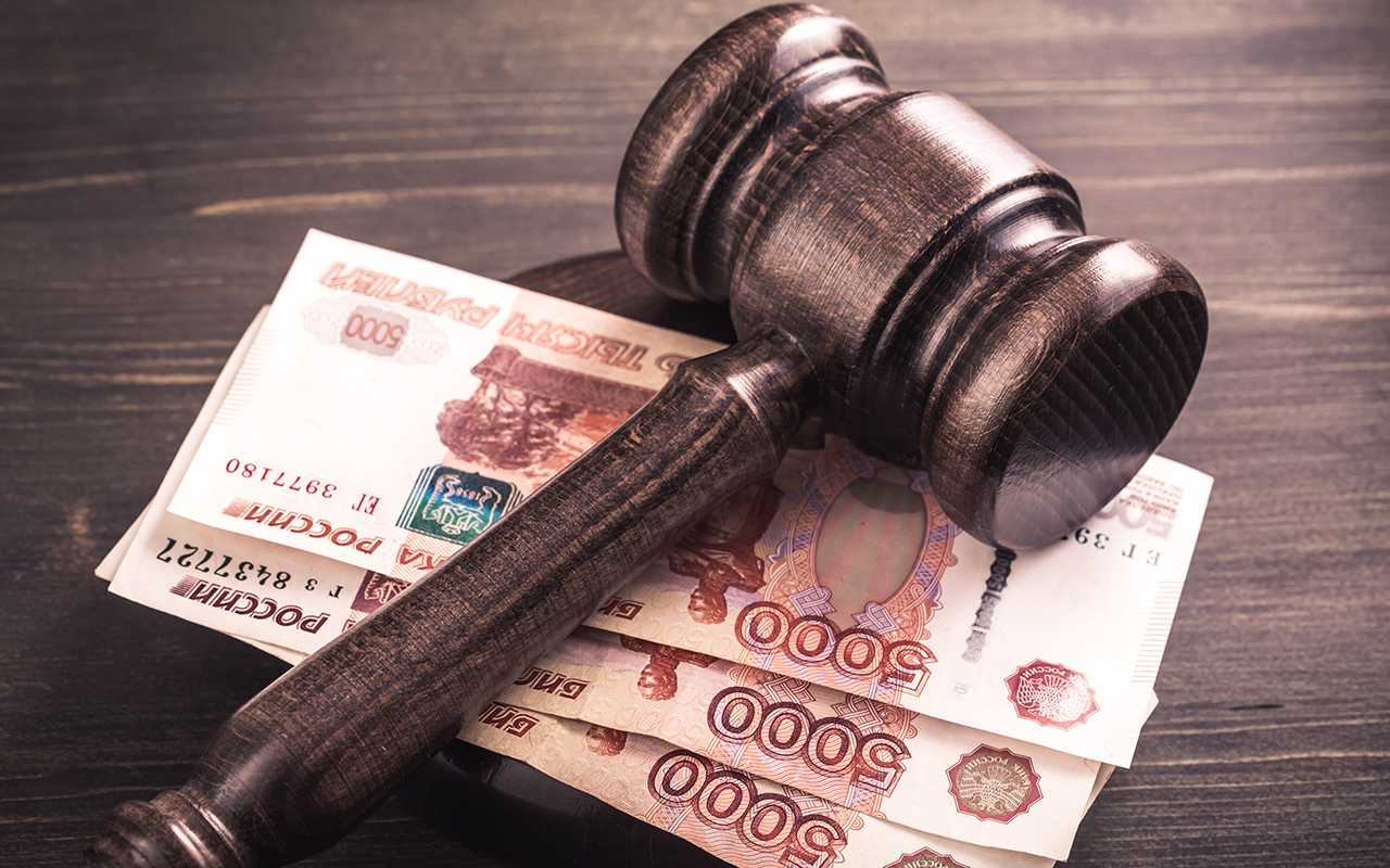 Gavel and some ruble banknotes.Auction bidding, judicial system corruption concept.Toned